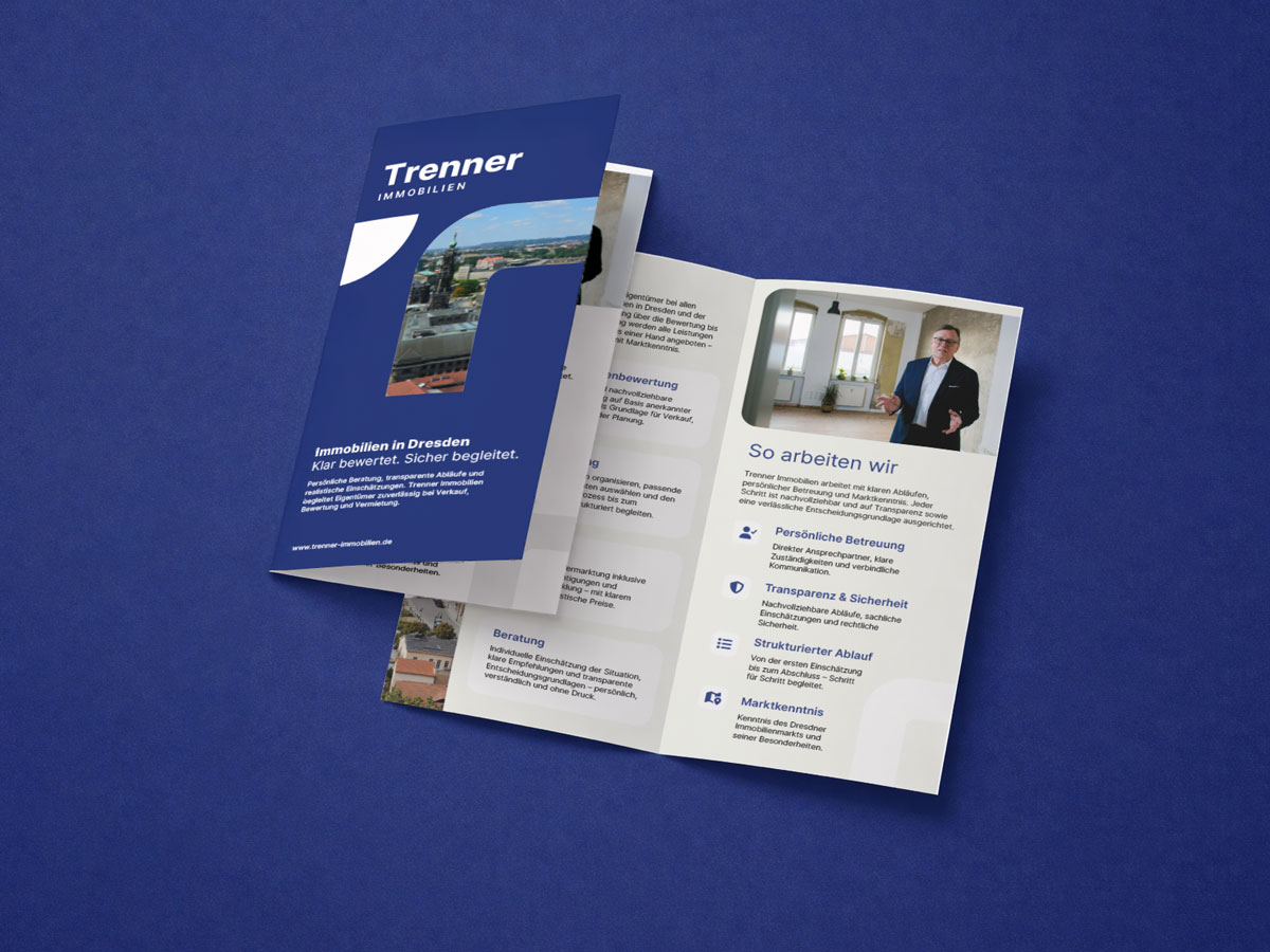 Visitenkarte mit Logo von Trenner Immobilien in Dunkelblau und Grau